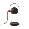 Aromatherapy wax lamp with a warm glow, emitting cozy fragrance to create a relaxing atmosphere during evening relaxation.