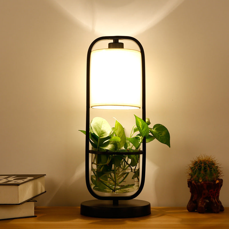 Modern hydroponic grow lamp illuminating indoor plants with sleek design, ideal for healthy greenery cultivation in stylish spaces.