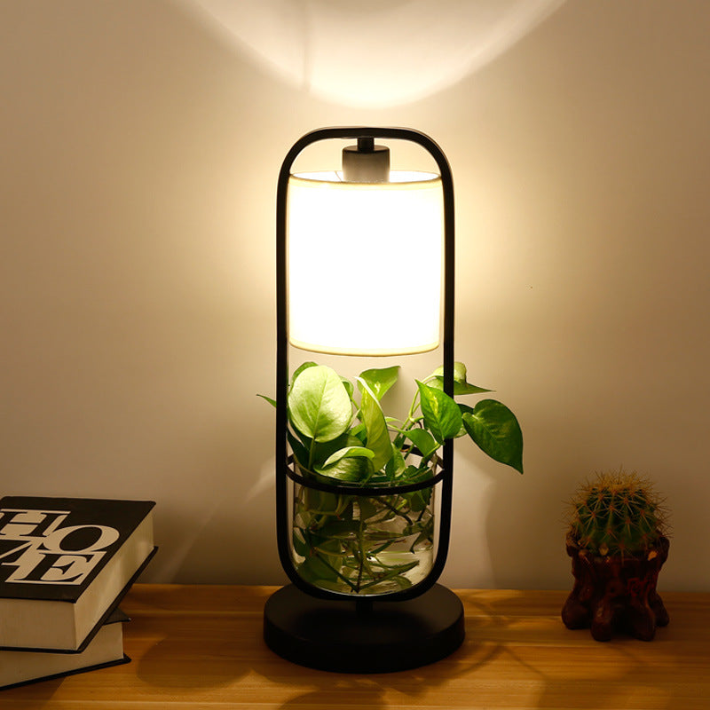Modern hydroponic grow lamp illuminating indoor plants with sleek design for healthy greenery growth.
