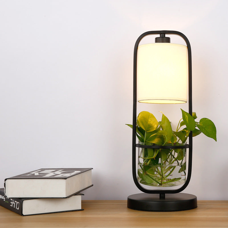 Modern hydroponic grow lamp illuminating leafy green plants, designed for stylish indoor gardening and optimal plant growth.