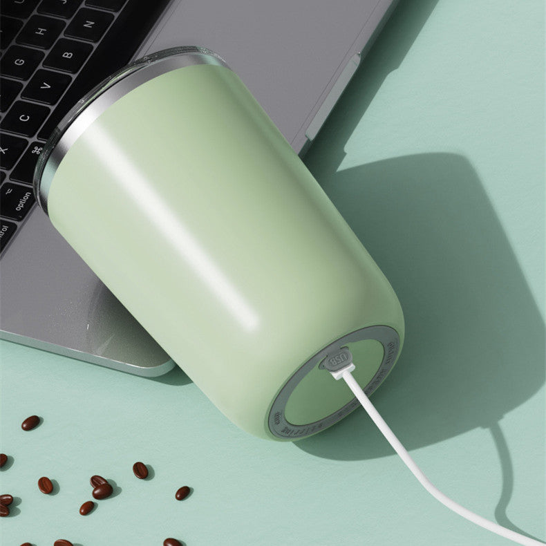 Magic self-stirring mug with a sleek design, featuring a button to effortlessly mix drinks inside the mug.