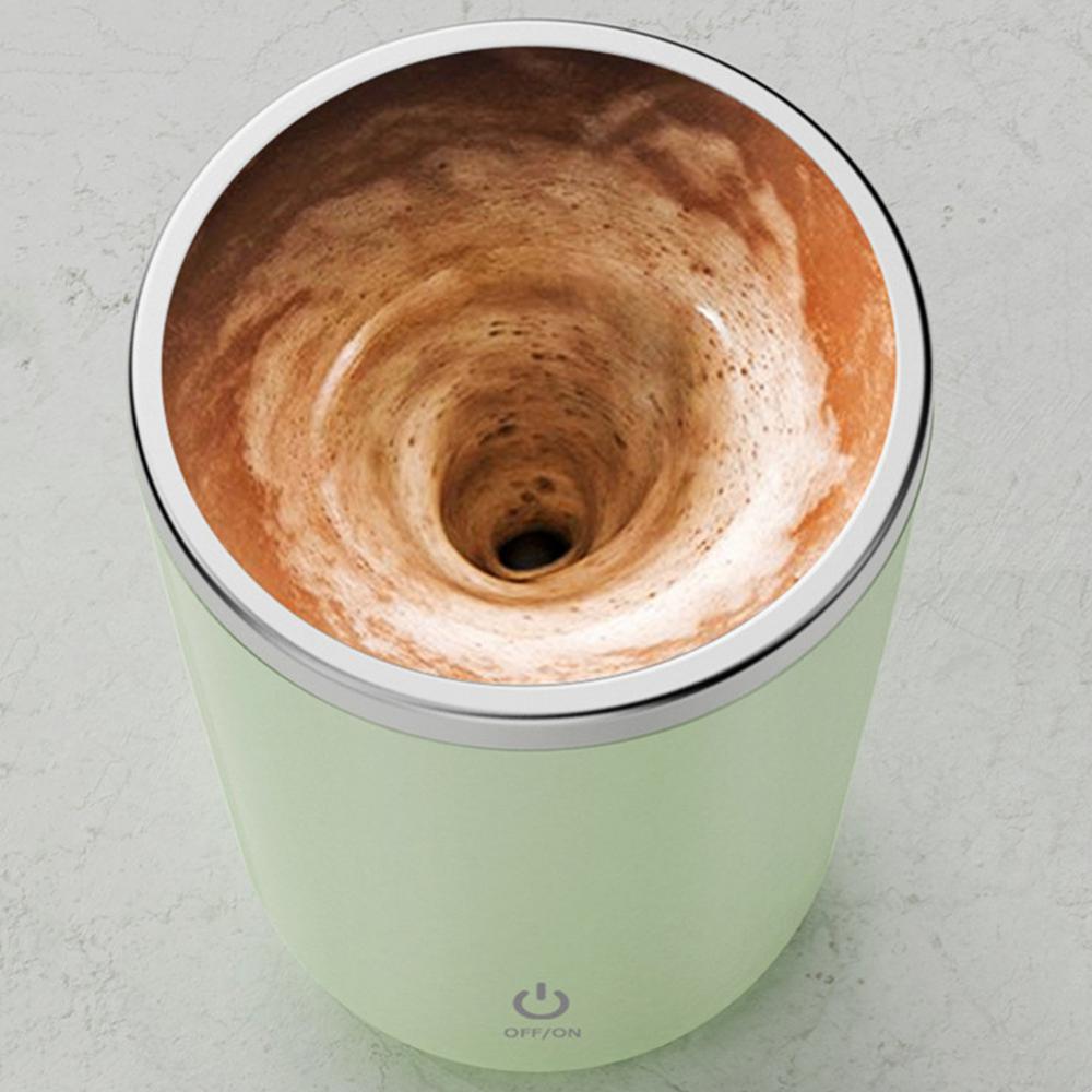 Magic self-stirring mug with a sleek design, perfect for mixing coffee, tea, or beverages with a simple press.