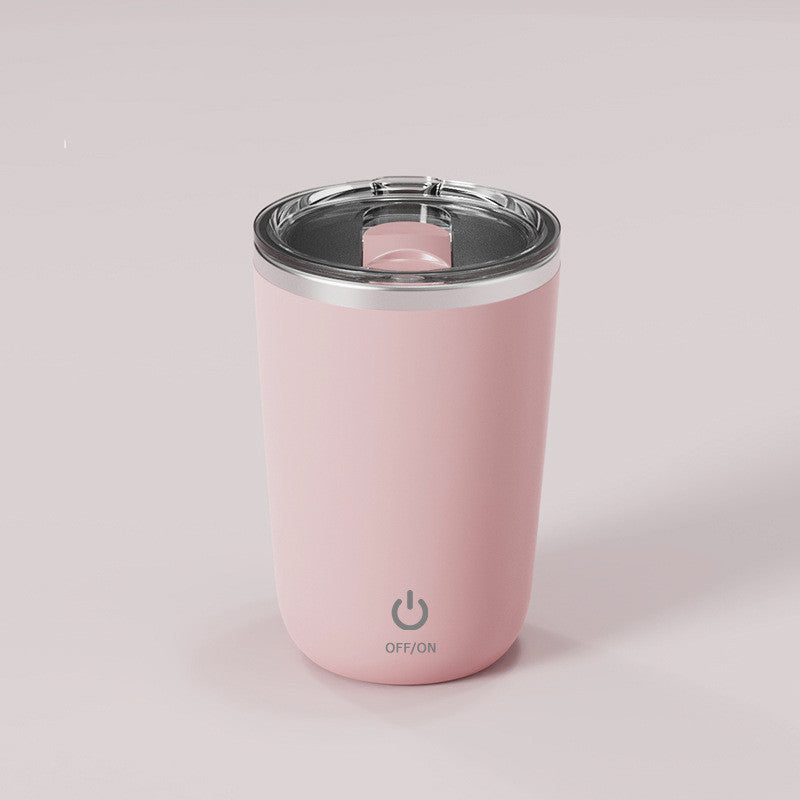 Magic self-stirring mug with button for automatic mixing of beverages, ideal for coffee, tea, or hot chocolate.