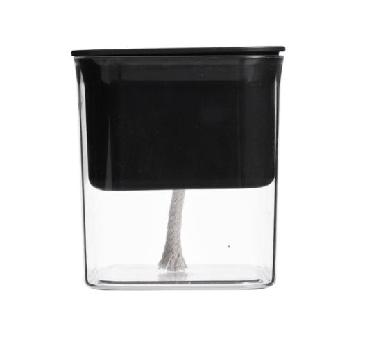 Transparent hydroponic planter with water reservoir, showcasing healthy green plants growing in a modern, clear gardening container.