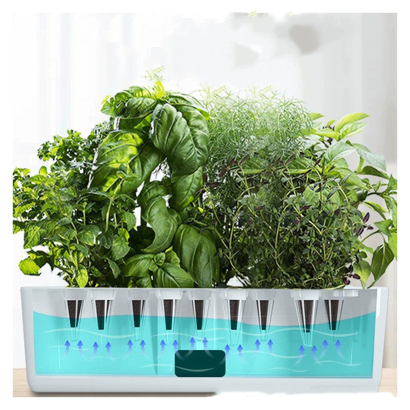 Hydroponic garden planter showcasing a soil-free indoor gardening system with lush green plants for fresh home-grown herbs.